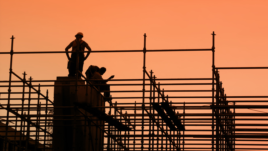 Construction workers on scaffolding.